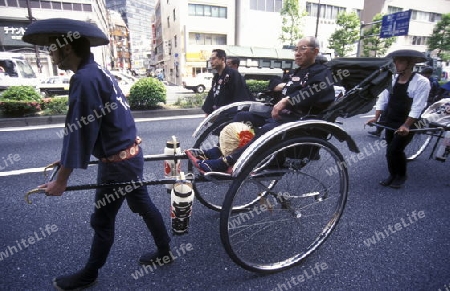 a Riksha at the big Festival in the Asakusa Senso Ji Tempel in the city centre of Tokyo in Japan in Asia,



