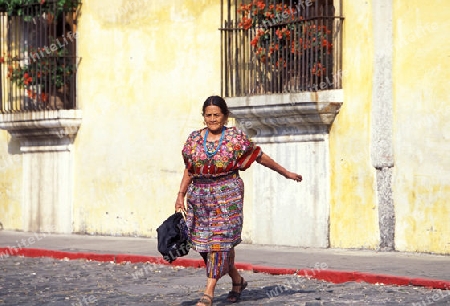a indio women in the old town in the city of Antigua in Guatemala in central America.   