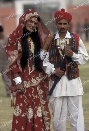 a couple, a men is dresst a women, at the kamel Festival in the town of Bikaner in the province Rajasthan in India.