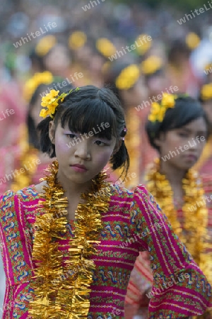 Traditional Dance Girls at the Thingyan Water Festival at the Myanmar New Year in the city centre of Mandalay in Manamar in Southeastasia.