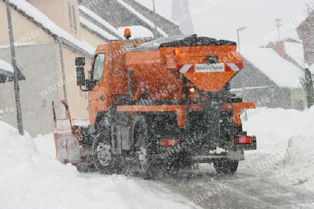 Winter service vehicle in use in heavy snow-fall 