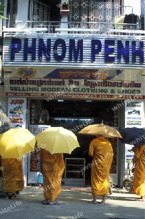 monk in the city centre in the city of phnom penh in cambodia in southeastasia. 
