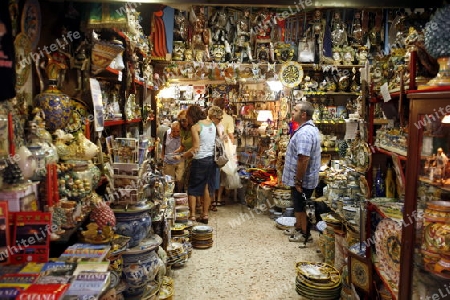 shops in the streets in the old Town of Catania in Sicily in south Italy in Europe.