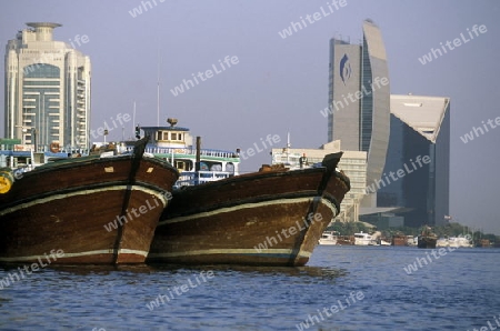 Import and export goods at the harbour at the Dubai creek in the old town in the city of Dubai in the Arab Emirates in the Gulf of Arabia.
