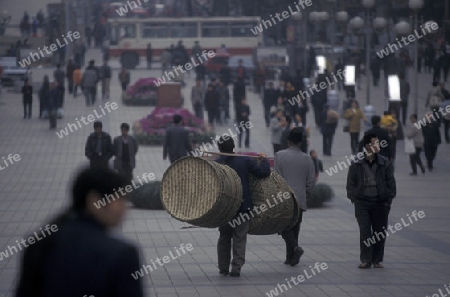 Transport people at the main square in the city of Chongqing in the province of Sichuan in china in east asia. 