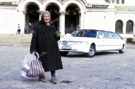 a women sales flowers at the Nevski church in the city of Sofia in Bulgaria in east Europe.