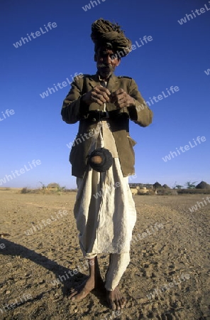 a men in the deset of tar near the town of Barmer in the province Rajasthan in India.
