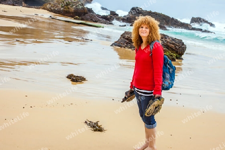 Red-haired hiker at Mystery Bay in New South Wales Australia