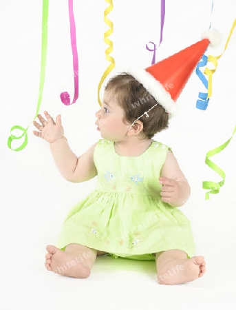 Stock Photo:  Party Girl in Hat and Streamers