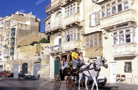 The traditional Balconys on the Houses in the Old Town of the city of Valletta on the Island of Malta in the Mediterranean Sea in Europe.
