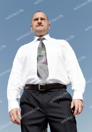 a businessman with sunglasses and blue background