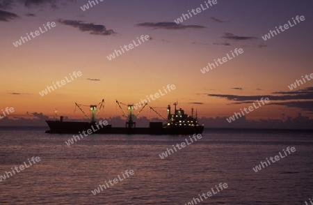  a ship in front of the city of Moutsamudu on the Island of Anjouan on the Comoros Ilands in the Indian Ocean in Africa.   