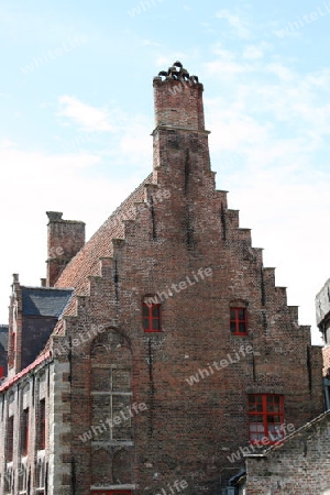 Beautiful old house with stepped gables, built of red brick stones  Sch?nes altes Haus mit Stufengiebel, aus roten Klinkersteinen erbaut