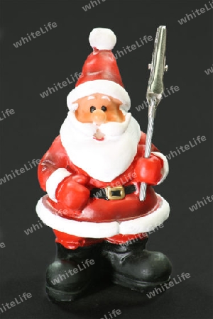 Cliphalter als Nikolausfigur auf schwarzem Hintergrund