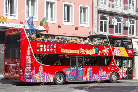 a tourist bus in Ribeira in Ribeira in the city centre of Porto in Porugal in Europe.