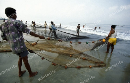 Fishing men at the beach of Colva in the Province Goa in India.
