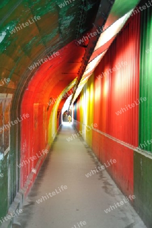 colorfully, gayfully, fascinatingly painted walls of an underground city walkway