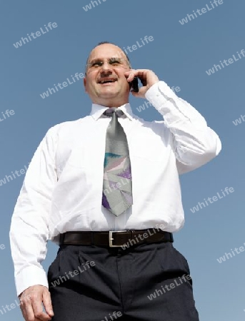 businessman talking with cellphone and smile