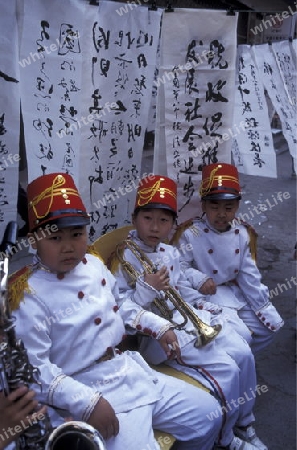 music childern in the city of wushan on the yangzee river in the three gorges valley up of the three gorges dam projecz in the province of hubei in china.