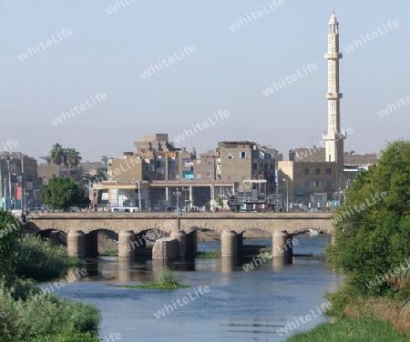city named "Esna" in Egypt, with river Nile and bridge