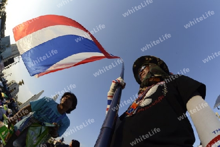 Thai anti-government protesters wave national flags during a rally at theDemocracy Monument in .Bangkok, Thailand, Saturday Jan.11 , 2014.