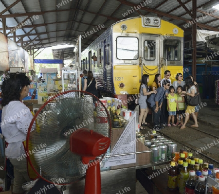 the Maeklong Railway Markt at the Maeklong railway station  near the city of Bangkok in Thailand in Suedostasien.