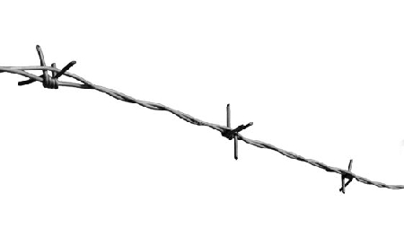 Barbed wire at high contrast as protection against invaders of any kind - Stacheldraht unter hohem Kontrast als Schutz vor Eindringlingen jeglicher Art