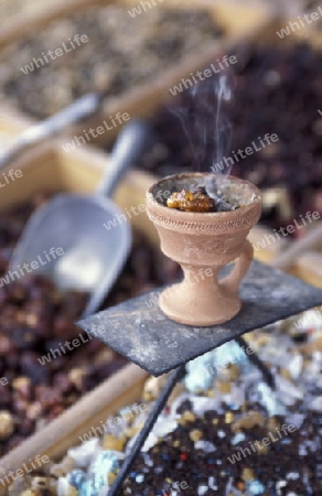 a incense Sohp in the souq or Market in the old town in the city of Dubai in the Arab Emirates in the Gulf of Arabia.