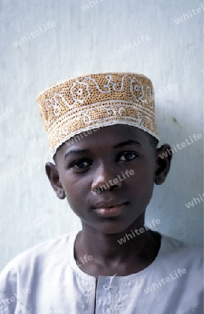 a boy in the city of Moutsamudu on the Island of Anjouan on the Comoros Ilands in the Indian Ocean in Africa.   