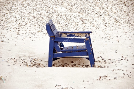 A stranded chair on the beach in Denmark