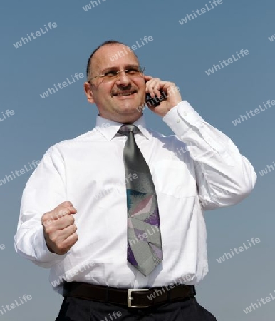 a businessman with cellphone and power