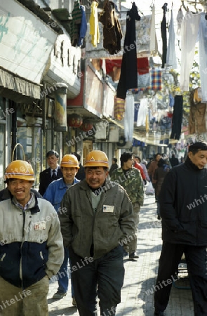 worker in the old town in the City of Shanghai in china in east asia. 