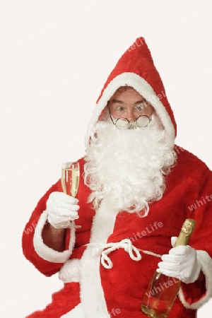Weihnachtsmann mit Sektglas und Sektflasche
