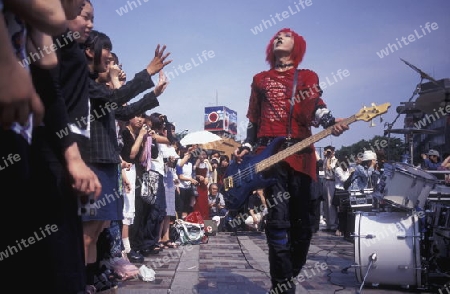 a Japanese Youth Punk Band plays on a square in the City of Tokyo in Japan in Asia,



