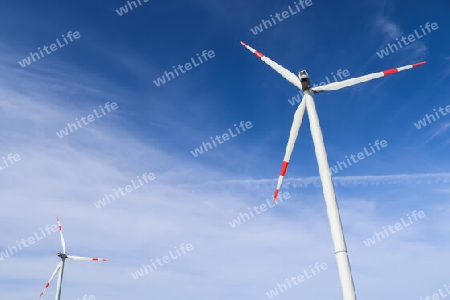View on alternative energy wind mills against the sky