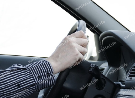 car driver with two hand on the steering wheel 