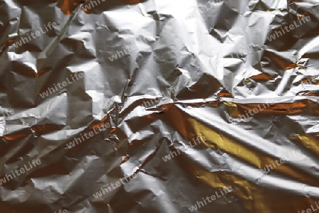 Detailed close up texture of an aluminum foil surface in different colors