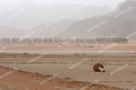a Sandstorm in the Landscape of the Wadi Rum Desert in Jordan in the middle east.