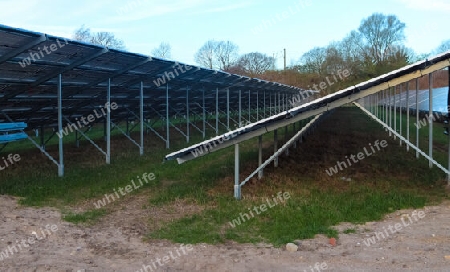 Generating clean energy with solar modules in a big park in northern Europe.