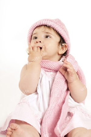 Stock Photo:  Baby Girl holding an alphabet block