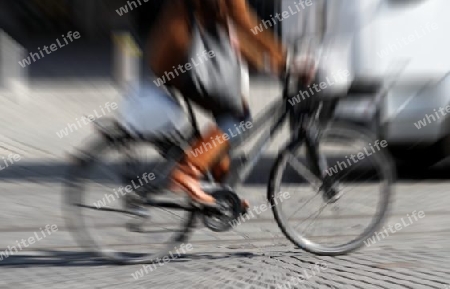 biking woman on the street