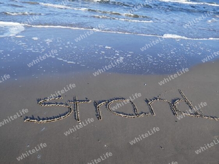Strand  in den Sand geschrieben