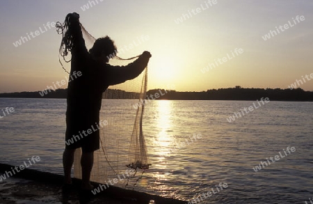  a fishing men at the river Danube in the city of Ruse on the border to romania in Bulgaria in east Europe.