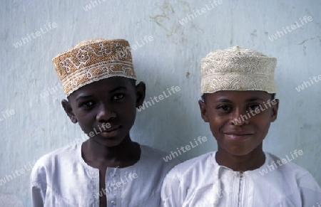 two boys in the city of Moutsamudu on the Island of Anjouan on the Comoros Ilands in the Indian Ocean in Africa.   