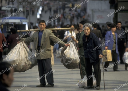 Transport people at the main square in the city of Chongqing in the province of Sichuan in china in east asia. 