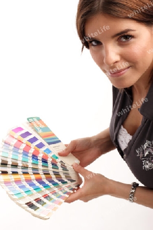 Young woman holding color guide
