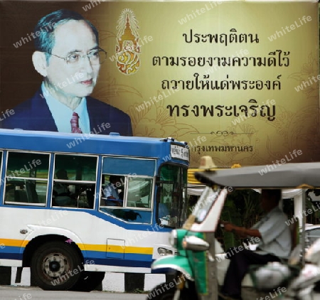 a pictures of the king bhumibol in the city of Bangkok in Thailand in Suedostasien.
