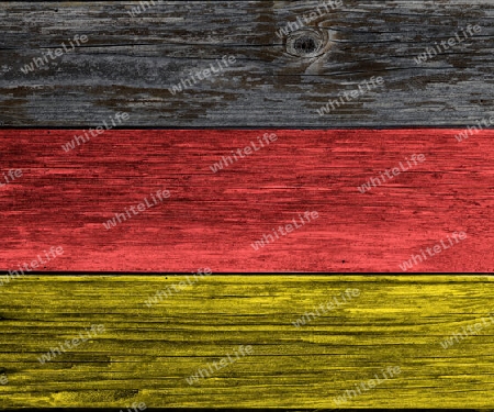 German flag colored wooden plank background. Texture with copy space