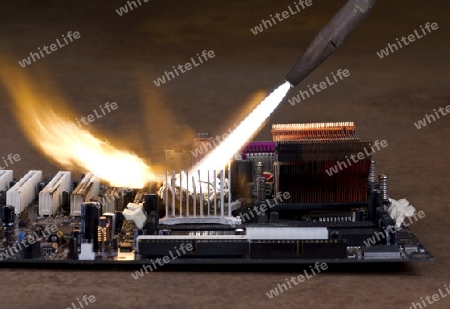 dashing flame from a welding rorch while burning a main board wich is located in rusty ambiance
