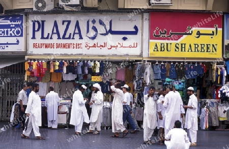 a shopping street in the souq or Market in the old town in the city of Dubai in the Arab Emirates in the Gulf of Arabia.